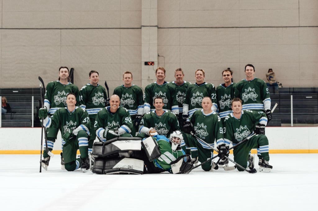 Frontier Airlines Hockey Club team photo on the ice